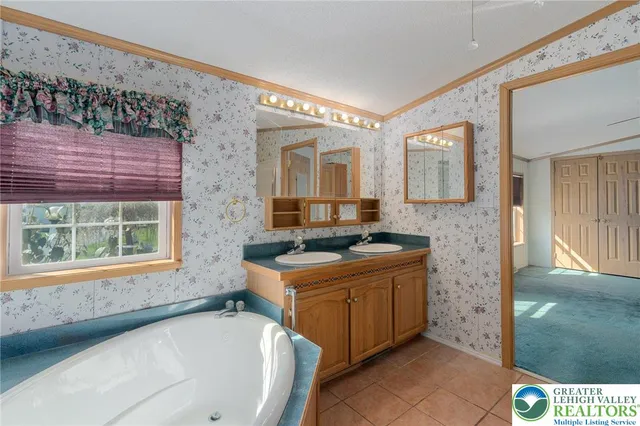 a view of a livingroom with a projector & cabinets