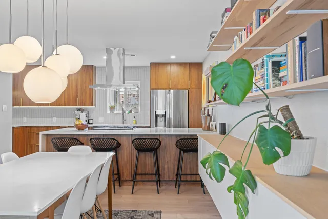 a kitchen with a table and chairs in it