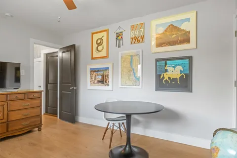 a view of room with window and furniture