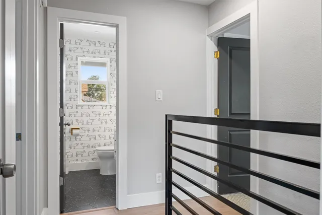 a bedroom with furniture and a book shelf