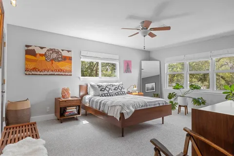 a bedroom with a bed and window