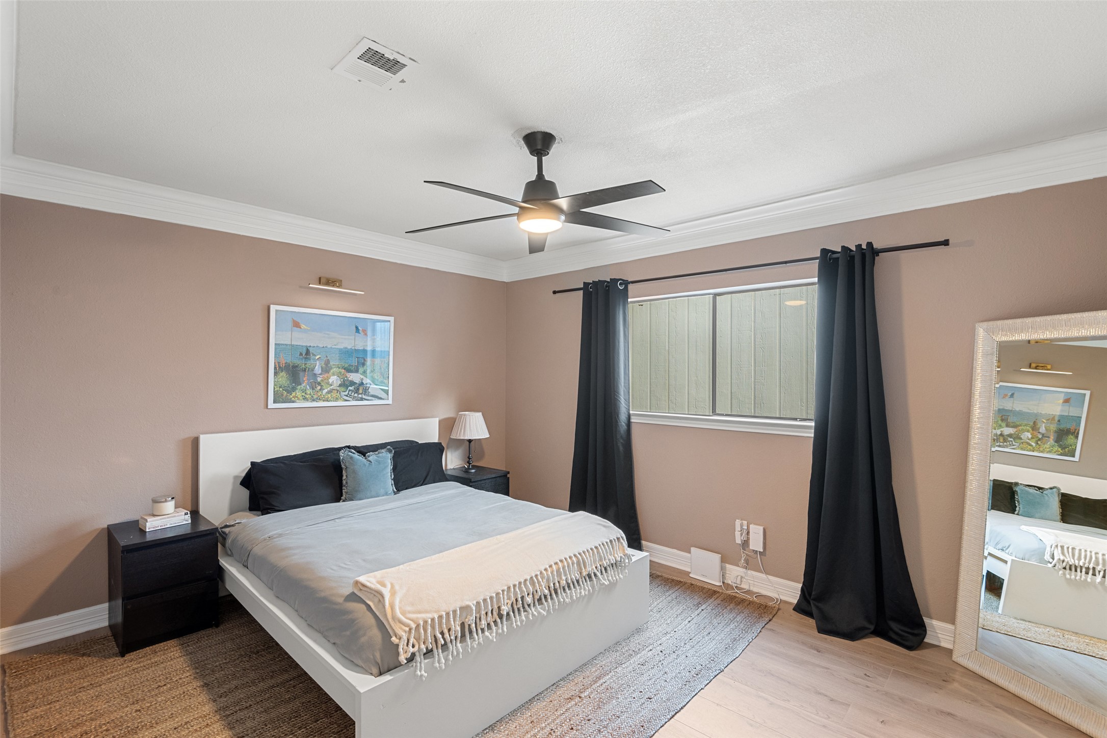 9833 Briar Ridge Drive Austin, TX 78748 - Photo 19 of 29 Bedroom with a ceiling fan, ornamental molding, and light wood finished floors