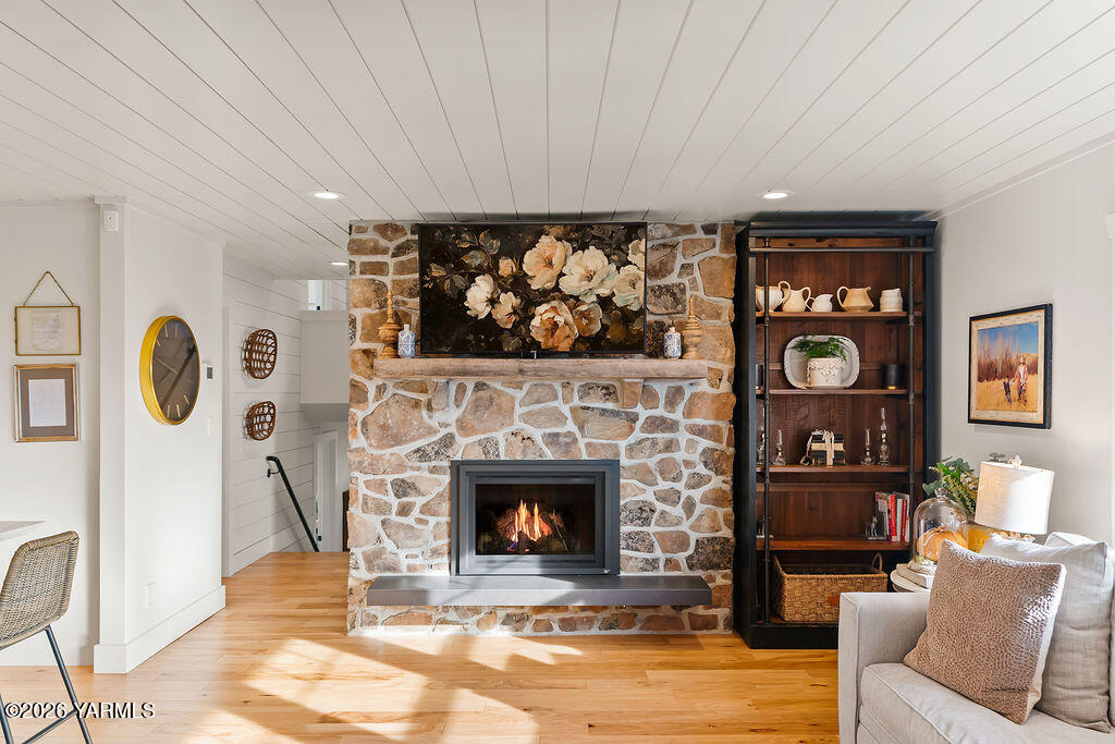 367 Baker Road Selah, WA 98942 - Photo 13 of 55 a living room with furniture a fireplace and a flat screen tv