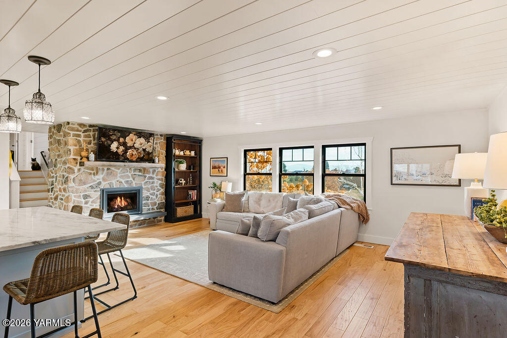 367 Baker Road Selah, WA 98942 - Photo 14 of 55 a living room with fireplace furniture and a floor to ceiling window