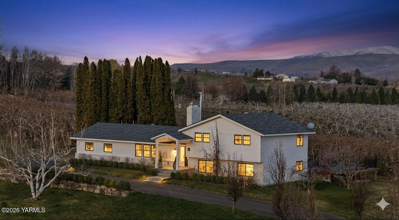 367 Baker Road Selah, WA 98942 - Photo 2 of 55 a front view of a house with a yard and a large tree