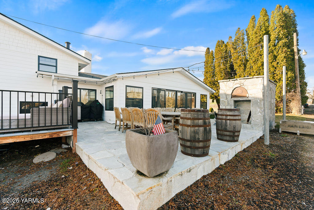 367 Baker Road Selah, WA 98942 - Photo 42 of 55 a view of a patio with couches chairs and potted plants