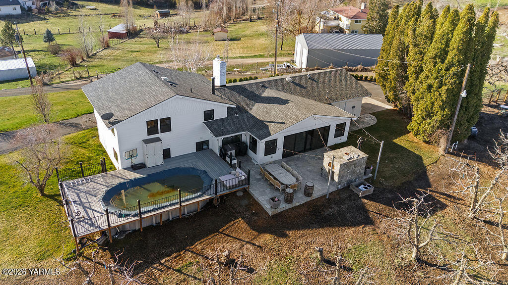 367 Baker Road Selah, WA 98942 - Photo 45 of 55 an aerial view of a house with swimming pool and outdoor seating