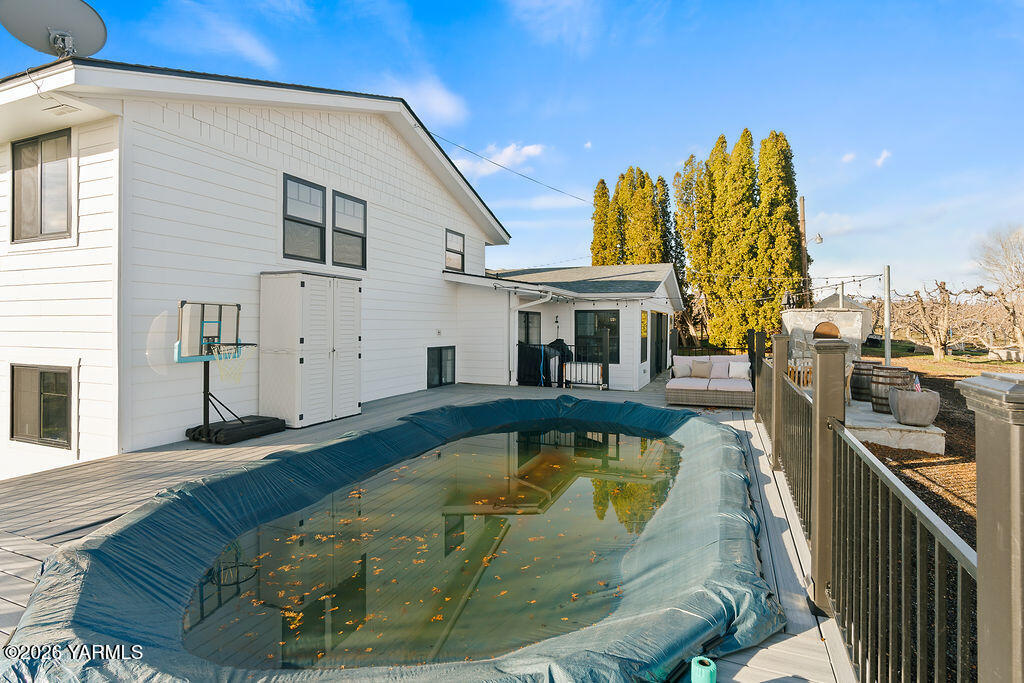367 Baker Road Selah, WA 98942 - Photo 49 of 55 a view of a swimming pool with a deck