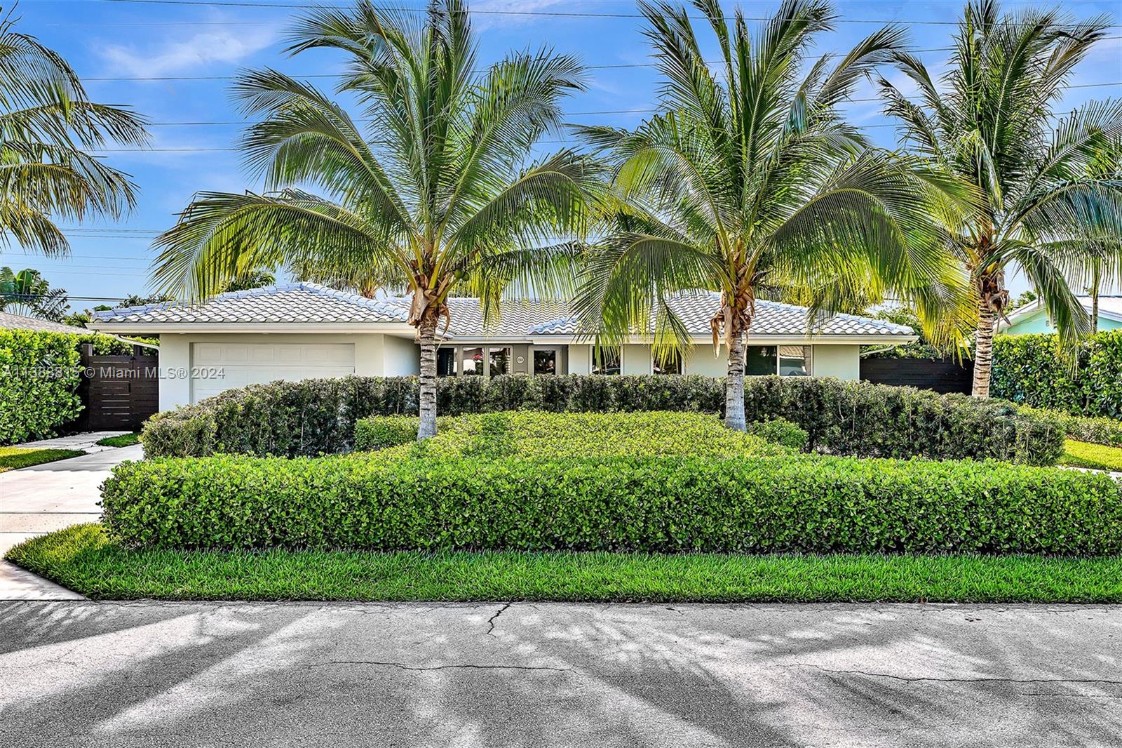 1344 Southwest 9th Avenue Boca Raton, FL 33486 - Photo 1 of 1 a view of a house with a yard and palm trees