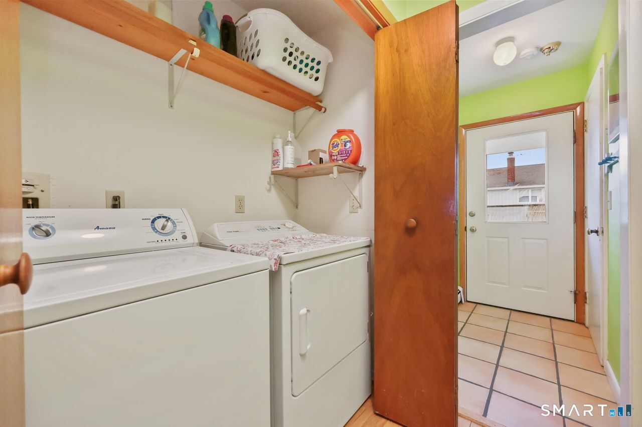 6 Lighthouse Point Fairfield, CT 06824 - Photo 20 of 40 a utility room with dryer and washer