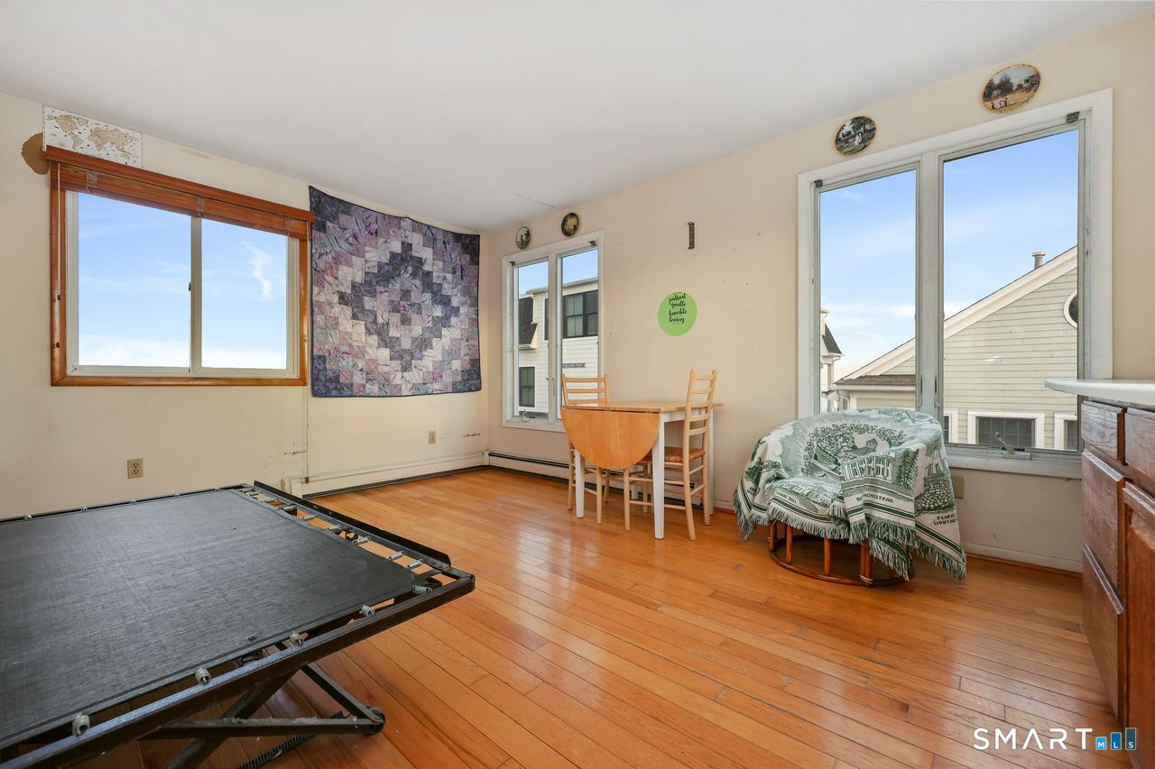 6 Lighthouse Point Fairfield, CT 06824 - Photo 21 of 40 a living room with furniture pool table and a large window