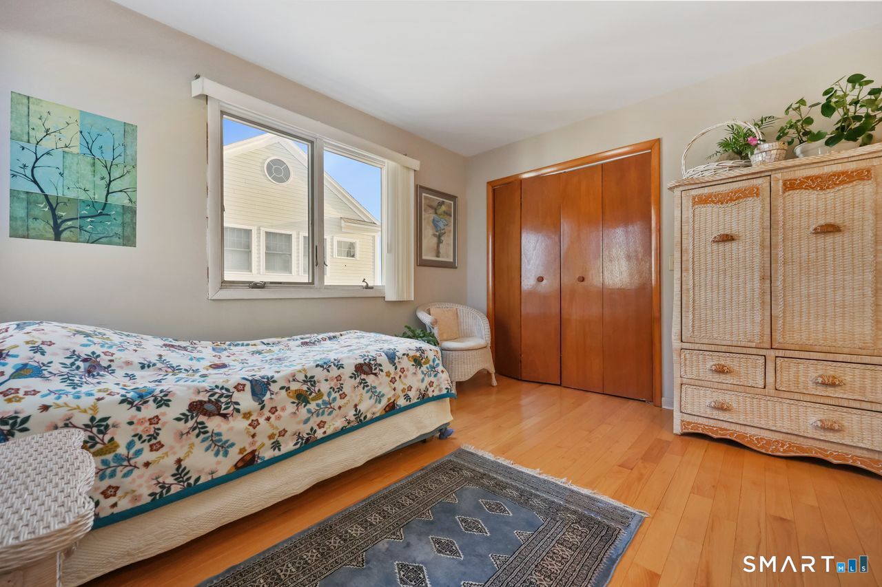 6 Lighthouse Point Fairfield, CT 06824 - Photo 25 of 40 a bedroom with a bed and a window