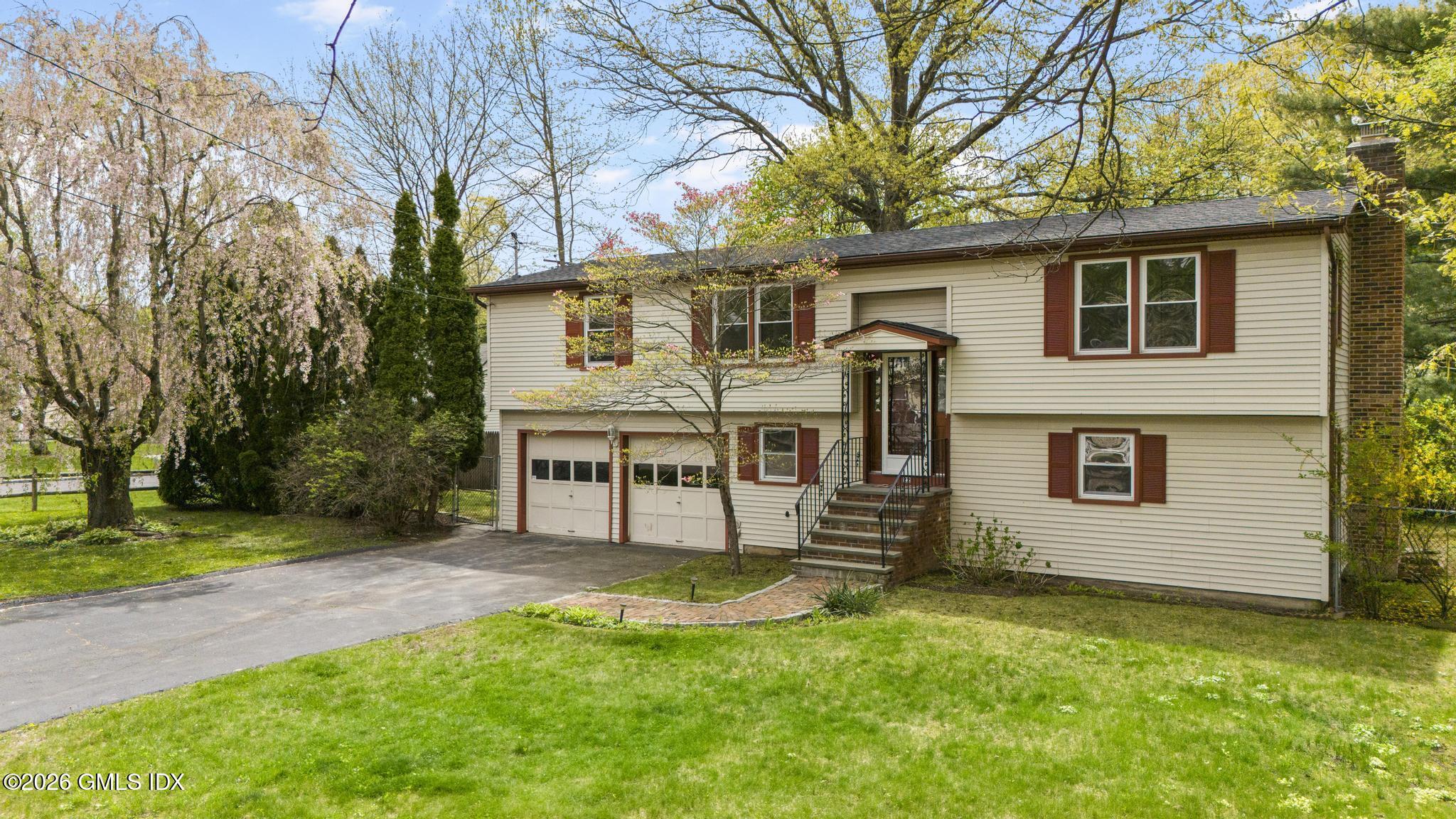 22 Carrona Drive Riverside, CT 06878 - Photo 1 of 26 a view of a house with a yard