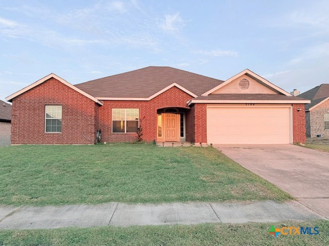 2104 Prestige Loop Killeen, TX 76549 - Photo 1 of 29 a front view of a house with a yard