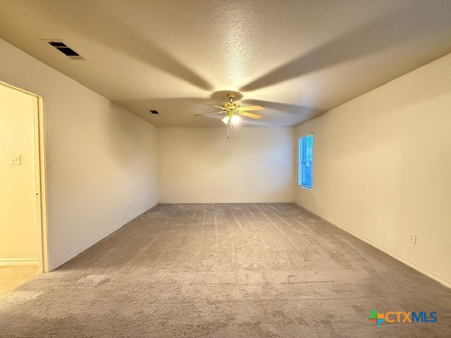 2104 Prestige Loop Killeen, TX 76549 - Photo 12 of 29 an empty room with a window and a ceiling fan
