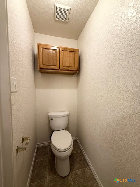 2104 Prestige Loop Killeen, TX 76549 - Photo 18 of 29 a bathroom with a toilet and a mirror