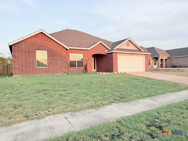 2104 Prestige Loop Killeen, TX 76549 - Photo 2 of 29 a front view of a house with a yard and garage