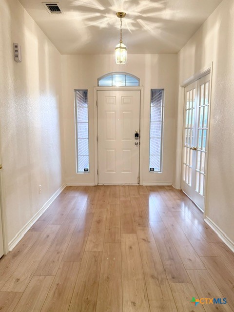 2104 Prestige Loop Killeen, TX 76549 - Photo 4 of 29 a view of an empty room with wooden floor and a window