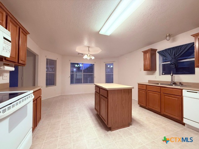 2104 Prestige Loop Killeen, TX 76549 - Photo 8 of 29 a large kitchen with stainless steel appliances granite countertop a stove and a sink