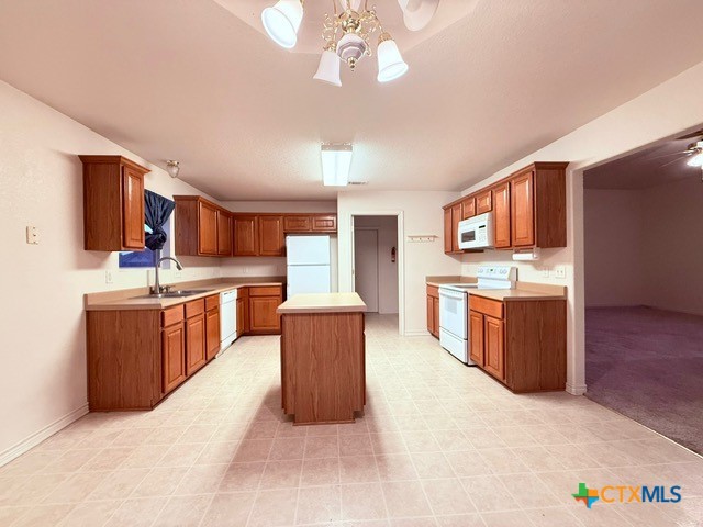 2104 Prestige Loop Killeen, TX 76549 - Photo 9 of 29 a large kitchen with stainless steel appliances kitchen island granite countertop a stove and a sink