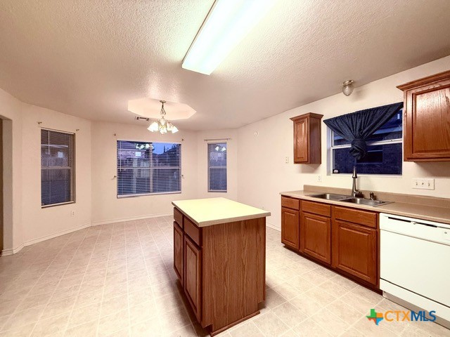 2104 Prestige Loop Killeen, TX 76549 - Photo 10 of 29 a kitchen with stainless steel appliances granite countertop a sink stove and refrigerator