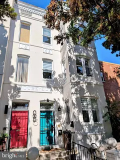 a view of a building with a tree