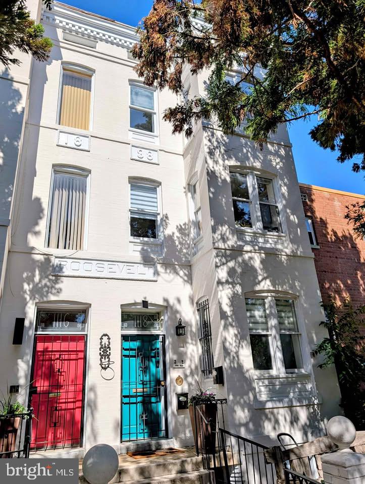 1118 F Street Northeast, Unit 3 Washington, DC 20002 - Photo 1 of 15 a view of a building with a tree