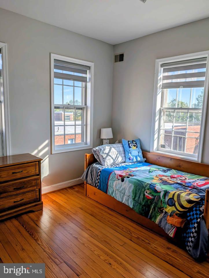 1118 F Street Northeast, Unit 3 Washington, DC 20002 - Photo 13 of 15 a bedroom with a bed and a window