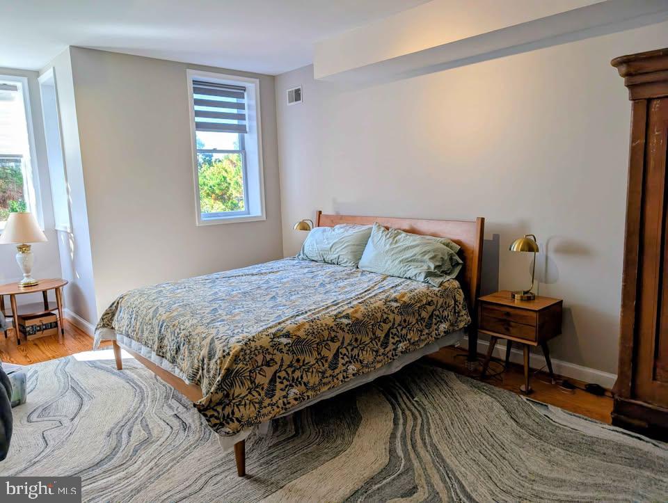1118 F Street Northeast, Unit 3 Washington, DC 20002 - Photo 10 of 15 a bedroom with a bed and a window