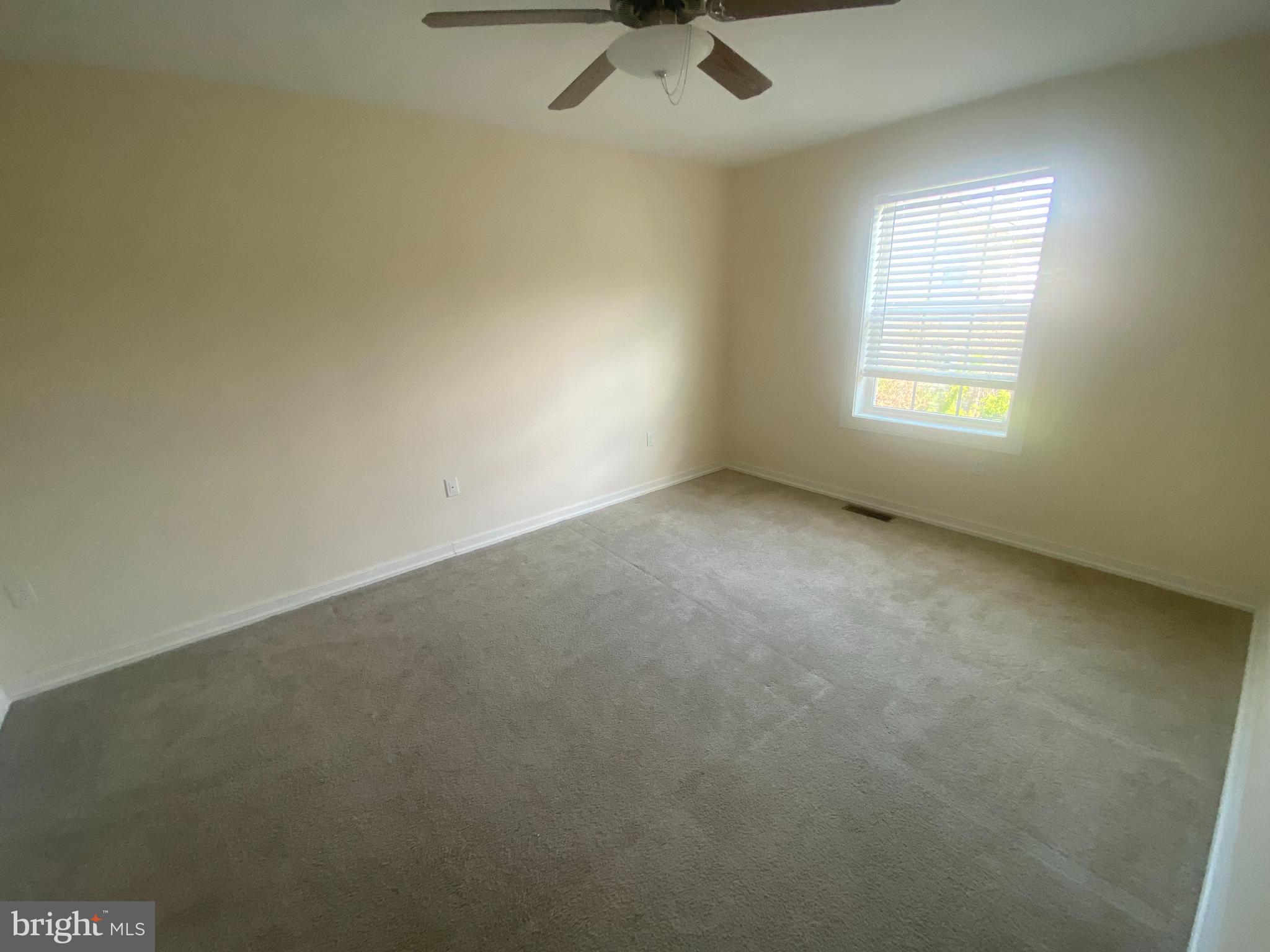 124 Mortimer Street Dunmore, PA 18512 - Photo 6 of 10 an empty room with a empty space and windows