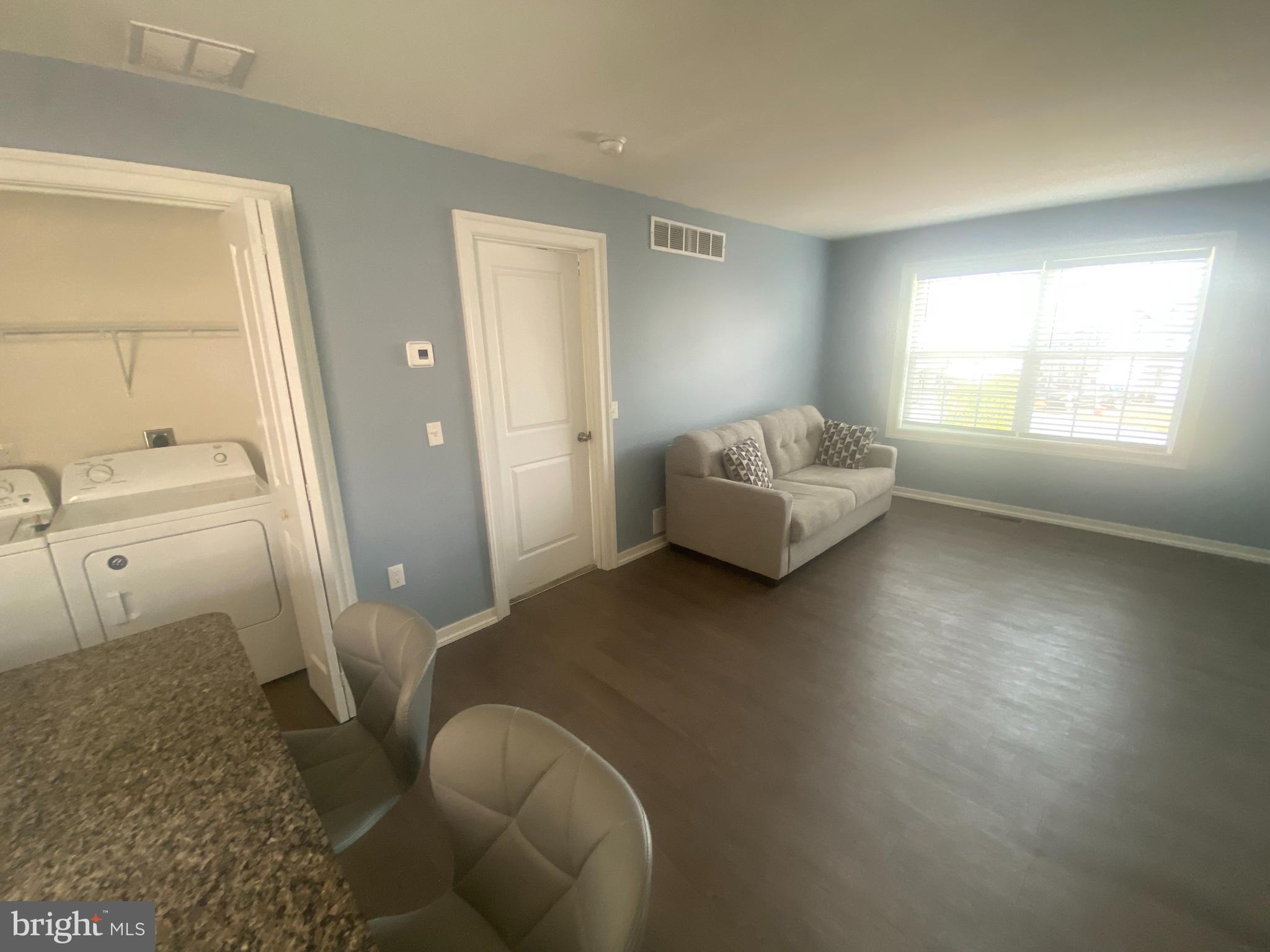 124 Mortimer Street Dunmore, PA 18512 - Photo 8 of 10 a living room with furniture and a window