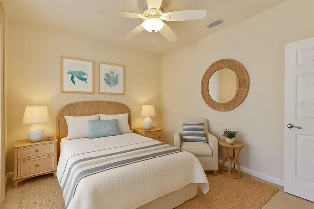 an empty room with a chandelier fan and closet