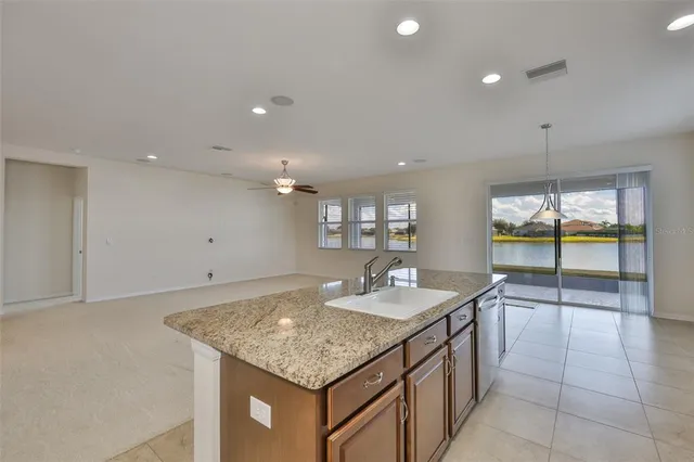 a view of a kitchen with a sink and a window