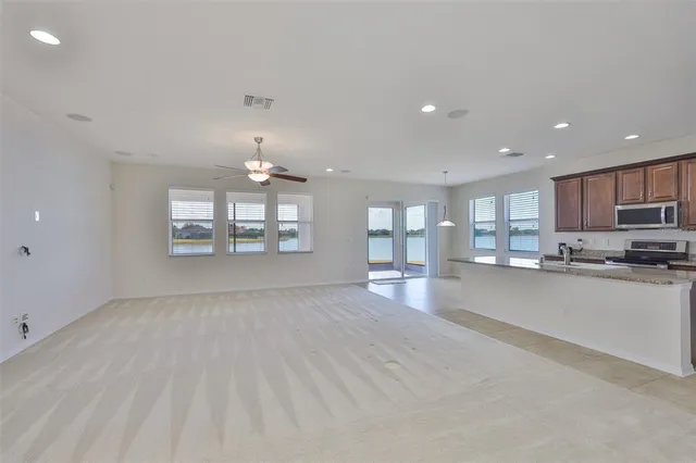 a view of an empty room with a fan
