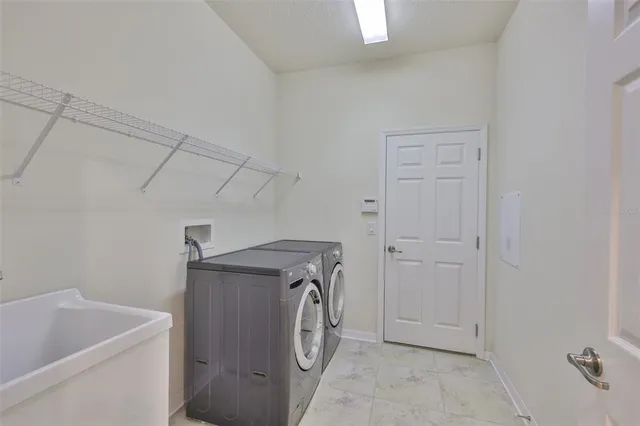 an aerial view of a house with a lake view