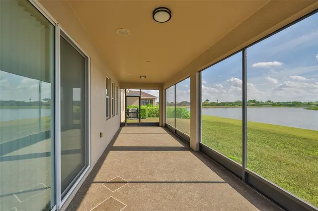 an aerial view of a house with a lake view