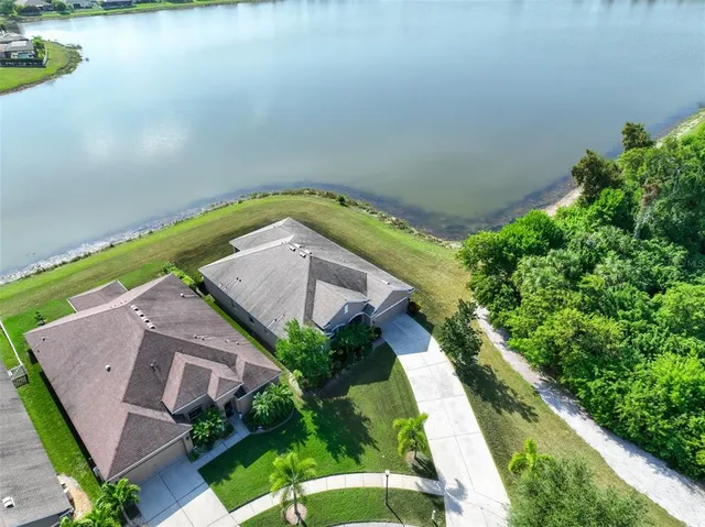 an aerial view of a house with a ocean view