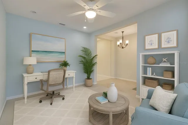 a view of a dining room with furniture and chandelier