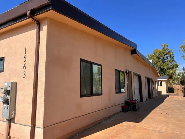 a front view of a house with large windows