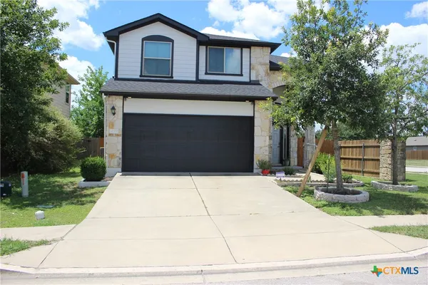 a front view of a house with yard