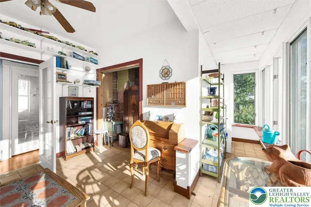 a view of a livingroom with furniture wooden floor and a chandelier