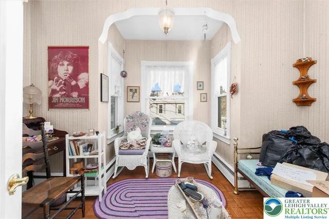 a living room with furniture and a flat screen tv