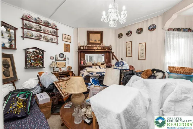 a bedroom with furniture and a chandelier