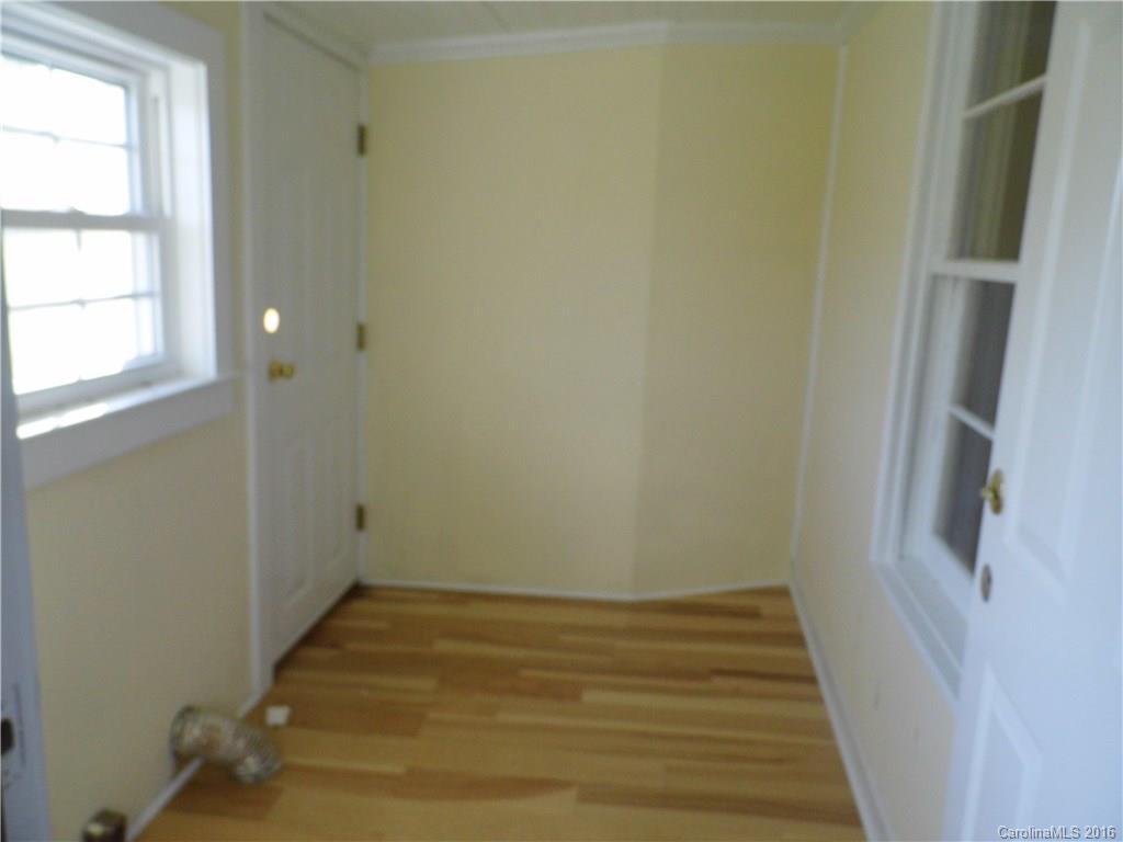 8376 Smith Road Stanfield, NC 28163 - Photo 10 of 15 a view of a room with wooden floor and window