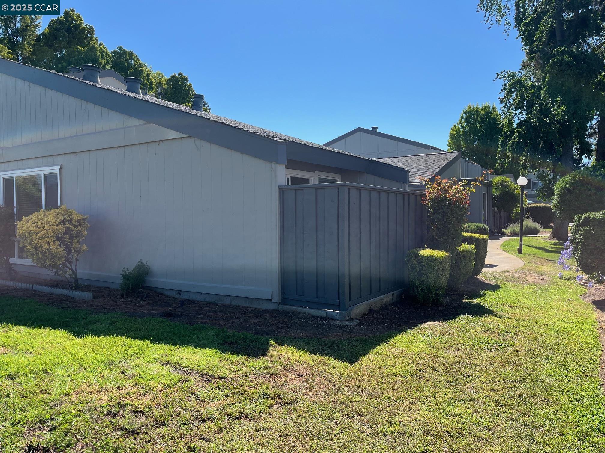 1395 Kenwal Road, Unit A Concord, CA 94521 - Photo 14 of 14 a view of a backyard with pathway