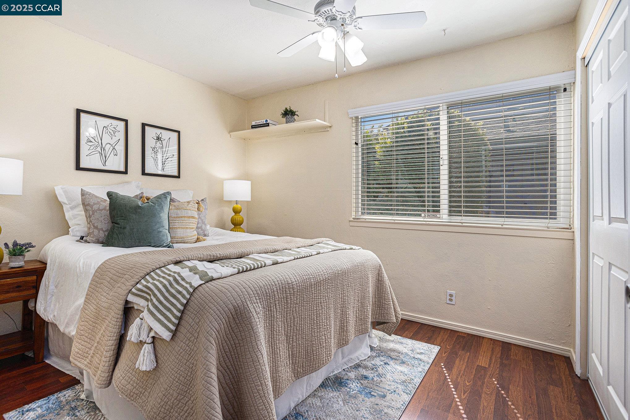 1395 Kenwal Road, Unit A Concord, CA 94521 - Photo 9 of 14 a bedroom with a large bed and a window