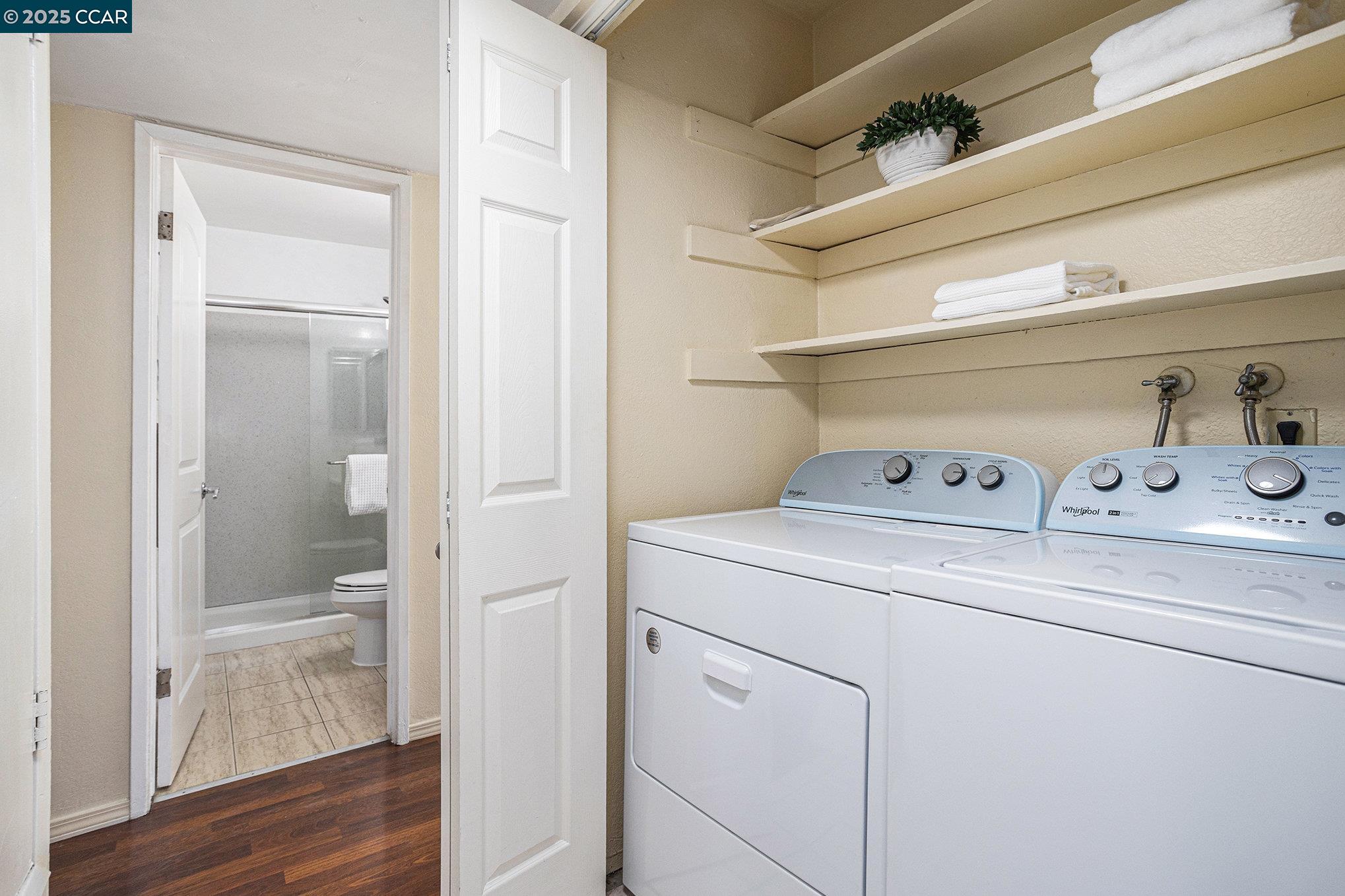 1395 Kenwal Road, Unit A Concord, CA 94521 - Photo 10 of 14 a view of washer and dryer with bathroom in the background