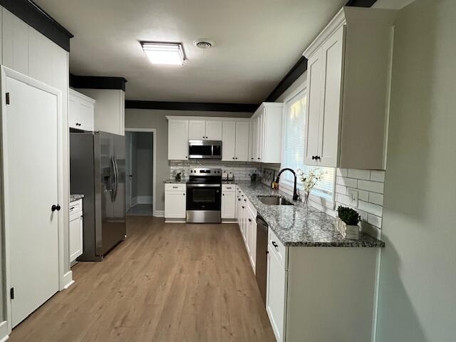 2537 Sandra Drive Augusta, GA 30906 - Photo 8 of 23 Kitchen with new appliances, including a microwave and granite counters.