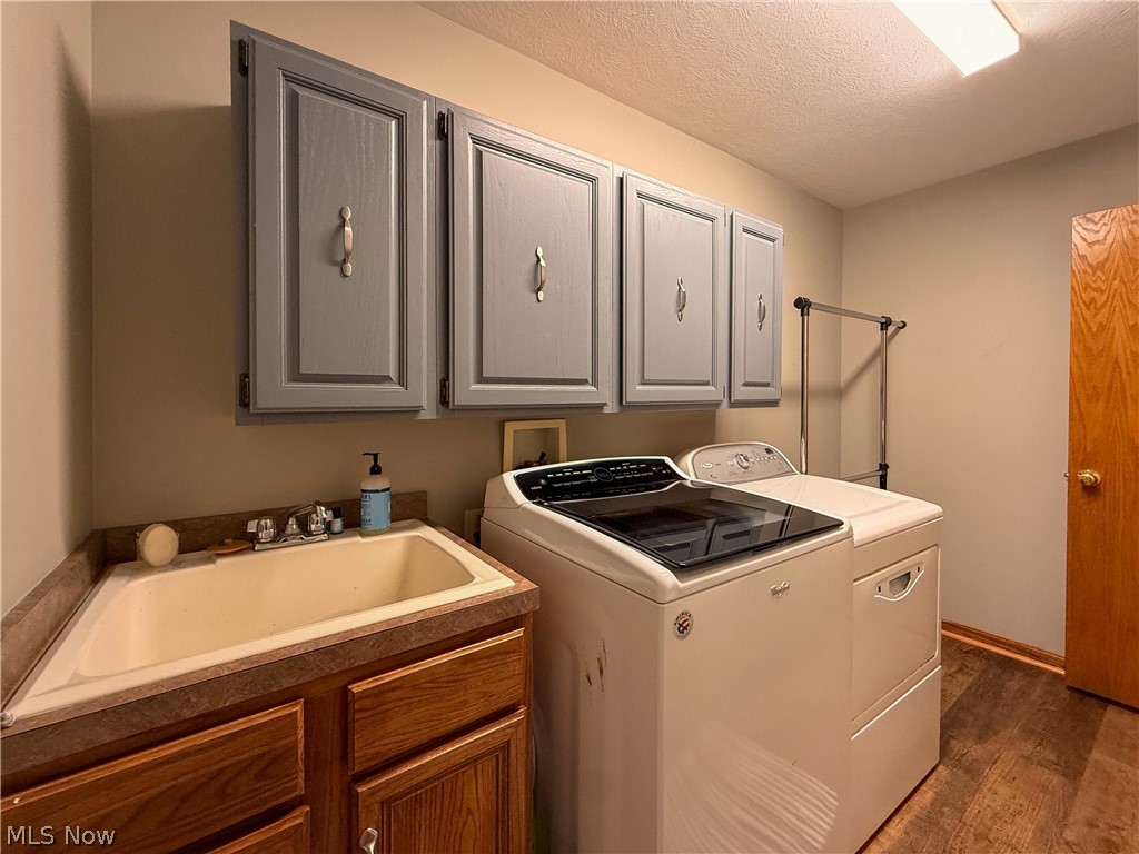 125 Pondview Circle Rittman, OH 44270 - Photo 12 of 38 Laundry room with custom sink and cabinets