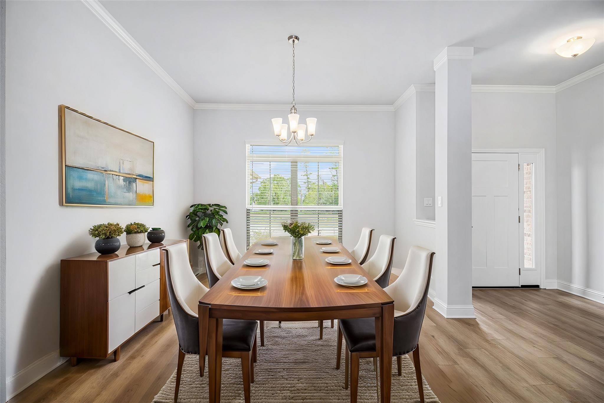 10 Greystone Court Angleton, TX 77515 - Photo 1 of 10 a view of a dining room with furniture window and wooden floor